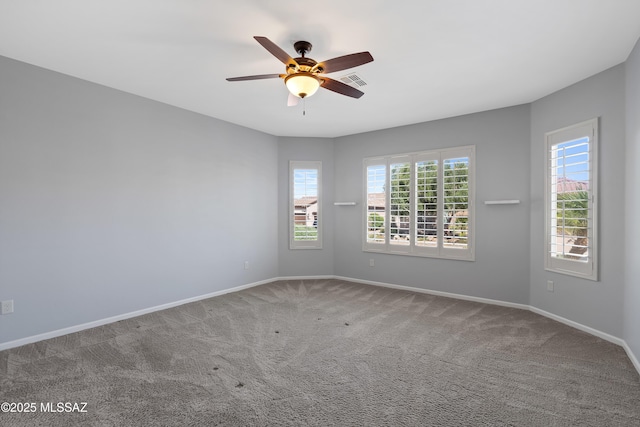 60241 E Arroyo Grande Dr, Oracle, AZ 85623 - spare room with carpet, ceiling fan, and baseboards