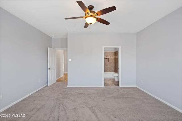60241 E Arroyo Grande Dr, Oracle, AZ 85623 - unfurnished bedroom featuring baseboards, carpet, ensuite bathroom, and ceiling fan