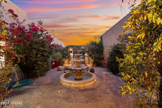 view of patio terrace at dusk