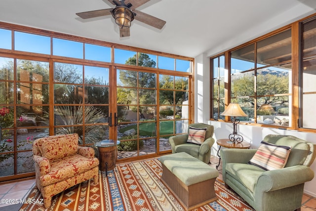 sunroom with ceiling fan and a wealth of natural light