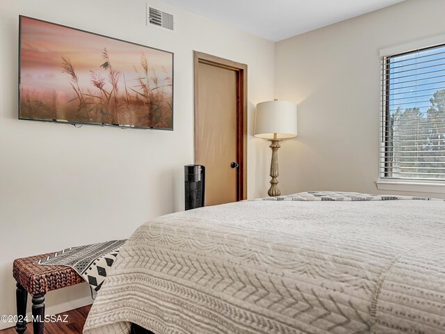 bedroom featuring wood-type flooring