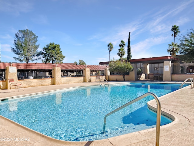 view of pool featuring a patio