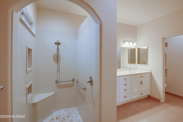 bathroom with vanity and walk in shower