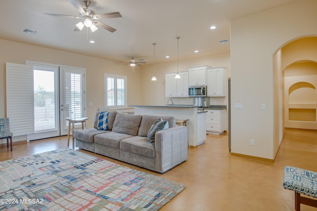 living room featuring ceiling fan