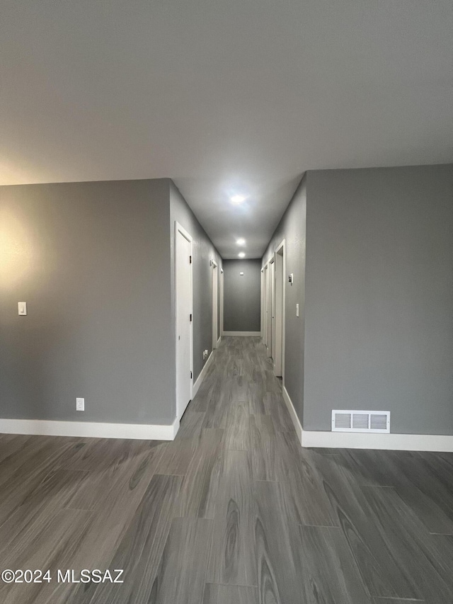 corridor featuring dark hardwood / wood-style floors