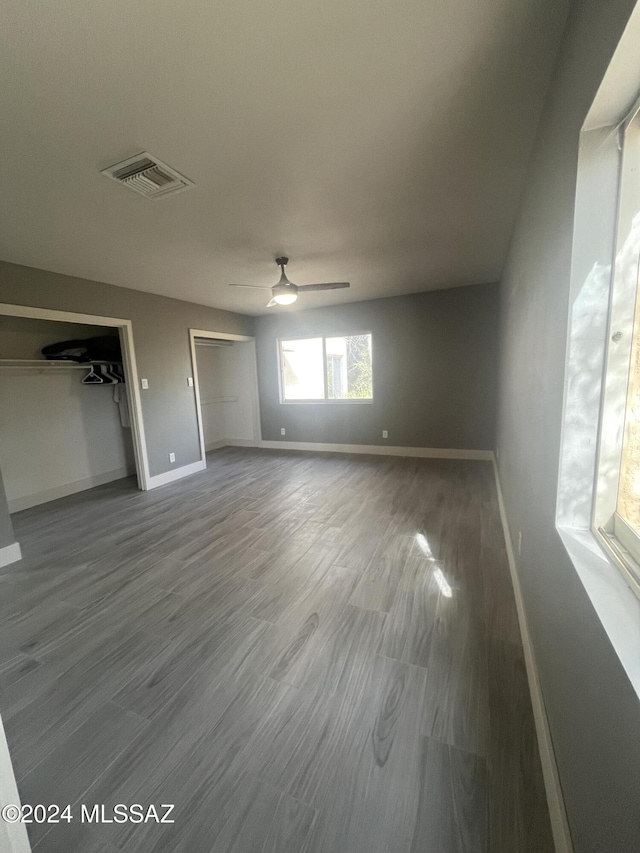 interior space with hardwood / wood-style floors and ceiling fan