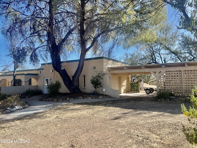 exterior space with a carport