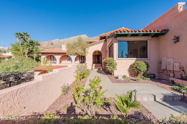 mediterranean / spanish-style home with a mountain view