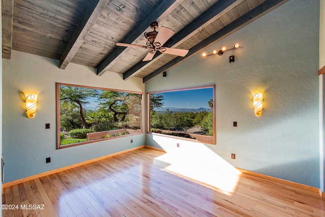 interior space with ceiling fan, light hardwood / wood-style flooring, lofted ceiling with beams, and wooden ceiling