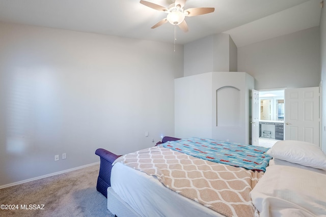 carpeted bedroom featuring ceiling fan, baseboards, and vaulted ceiling