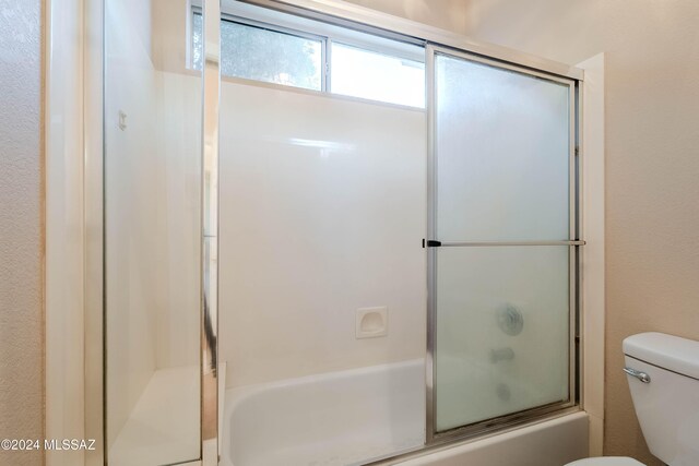 bathroom with vanity and bath / shower combo with glass door