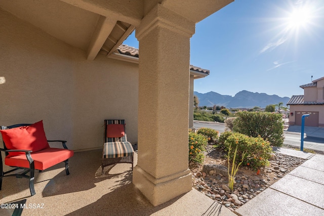 view of patio / terrace with a mountain view