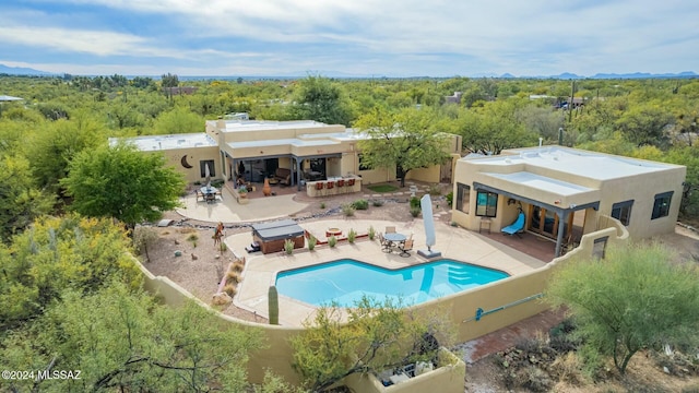 view of pool featuring a patio area