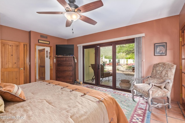 bedroom featuring ceiling fan, access to outside, and light tile patterned flooring