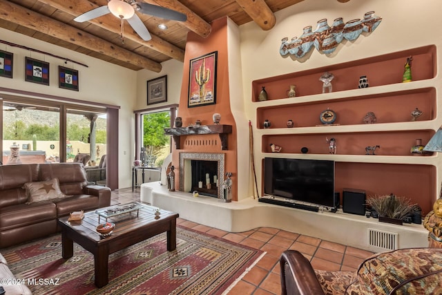 tiled living room with ceiling fan, wood ceiling, and beamed ceiling