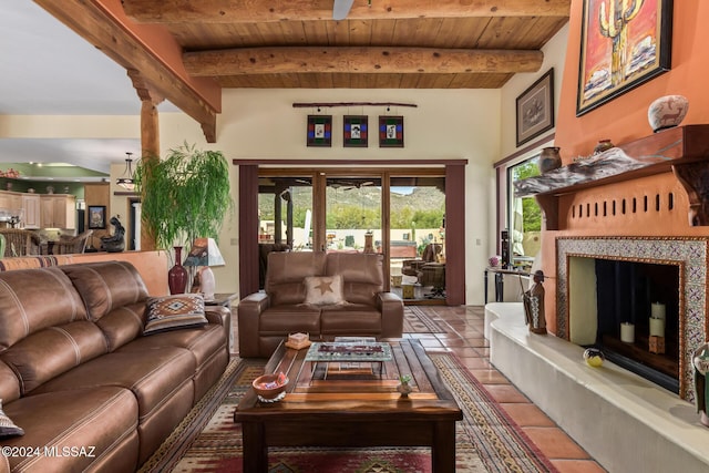 tiled living room featuring beam ceiling, a large fireplace, and wooden ceiling