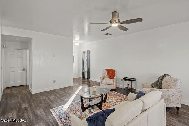 living room with dark hardwood / wood-style floors and ceiling fan