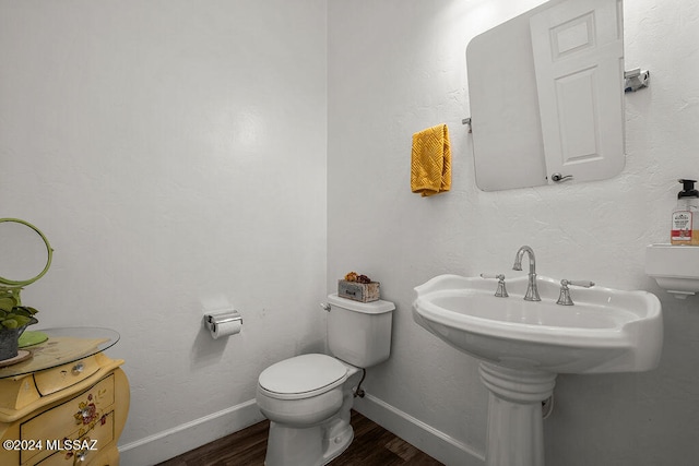 bathroom featuring toilet and hardwood / wood-style flooring