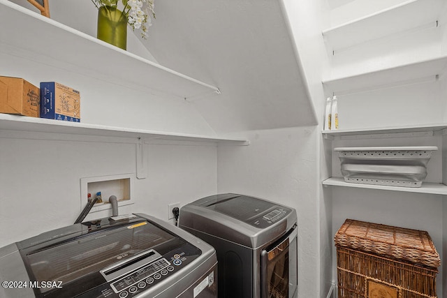 laundry room featuring washing machine and clothes dryer