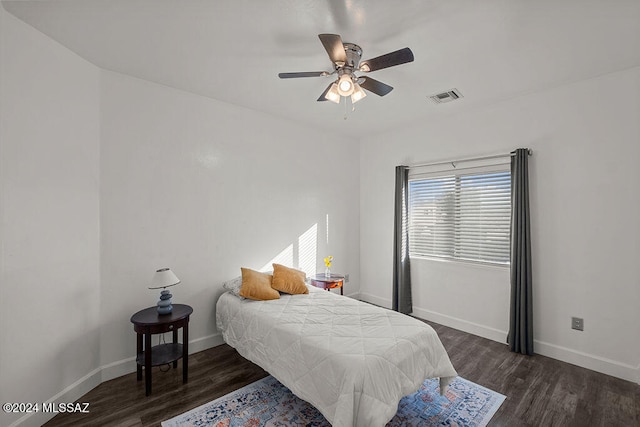 bedroom featuring ceiling fan and dark wood-type flooring