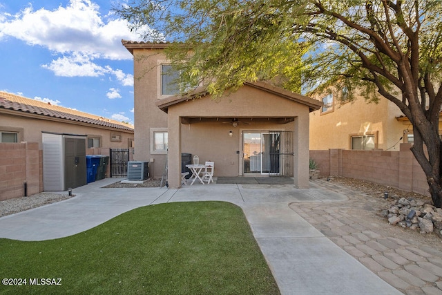 back of property featuring central AC unit, ceiling fan, and a patio