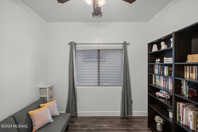 sitting room with dark hardwood / wood-style floors and ceiling fan