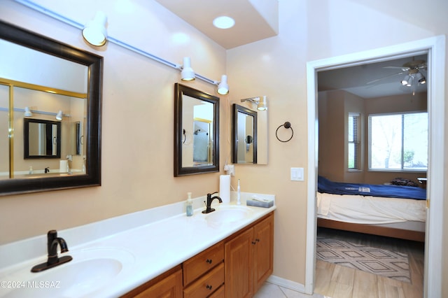 bathroom with ceiling fan and vanity