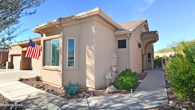 view of side of property with a garage