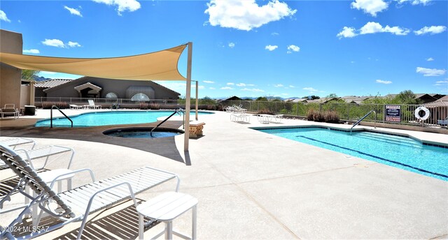 view of swimming pool with a patio area