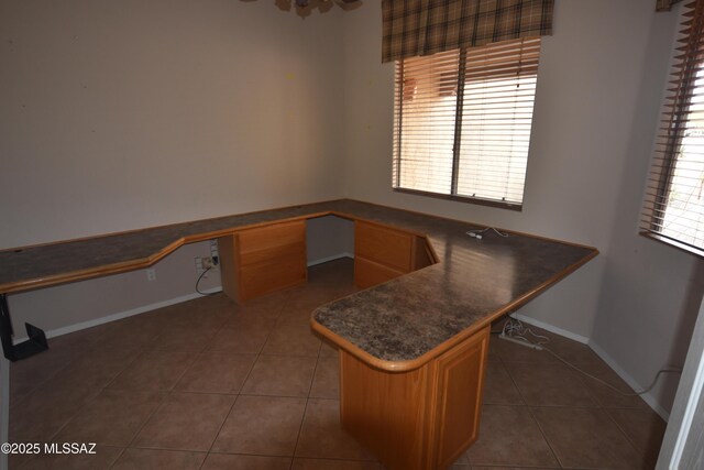 bathroom with toilet, vanity, tile patterned floors, and a shower with door