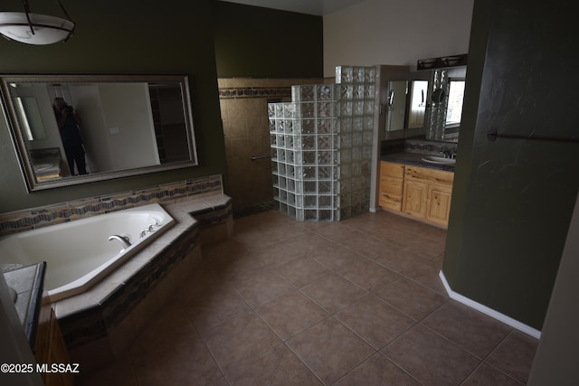 bathroom featuring vanity, tile patterned floors, and plus walk in shower