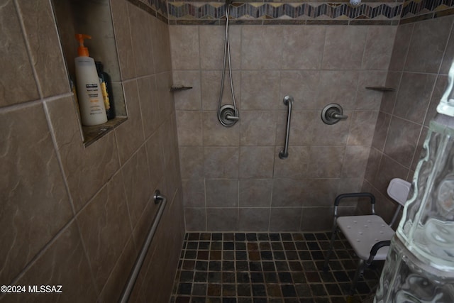 bathroom with tiled shower