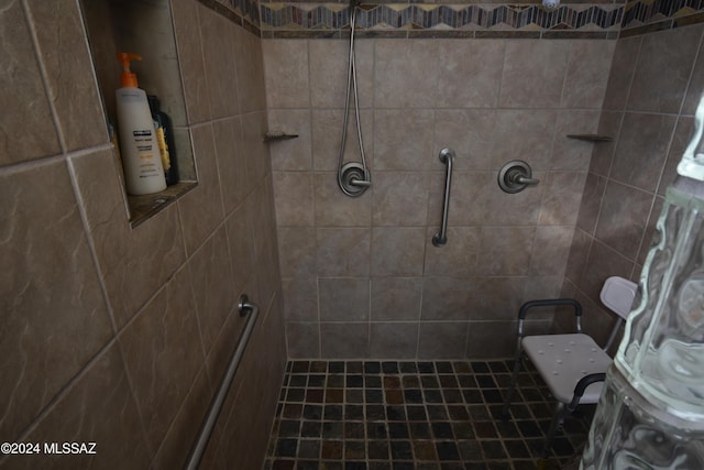 full bathroom with tiled shower