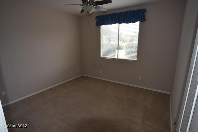 unfurnished room featuring baseboards, ceiling fan, and carpet flooring