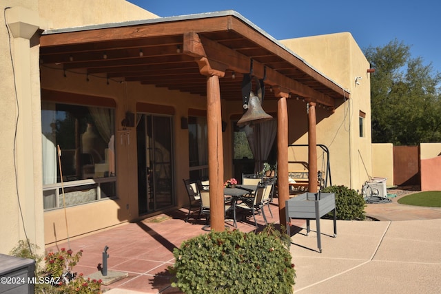 view of patio featuring outdoor dining area