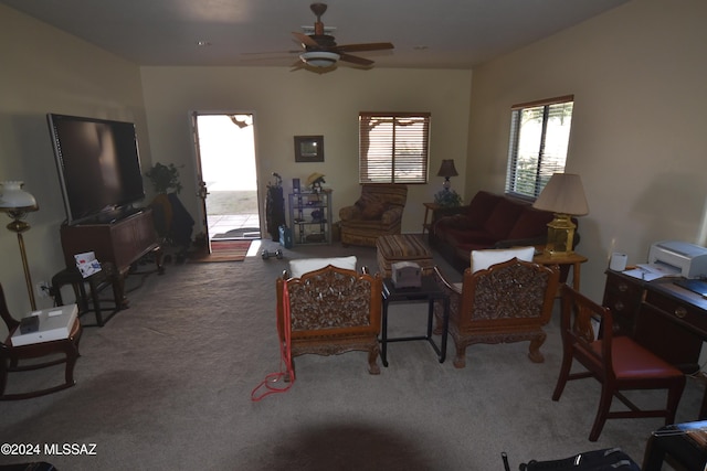 carpeted living room with ceiling fan