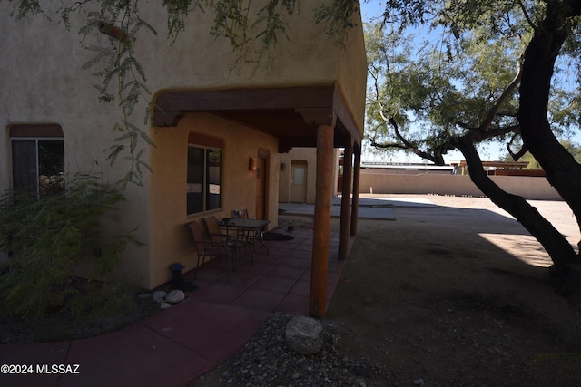 view of patio featuring fence