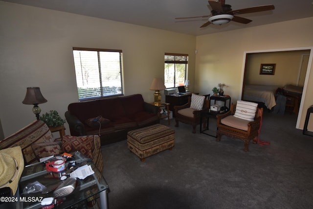carpeted living room featuring a ceiling fan