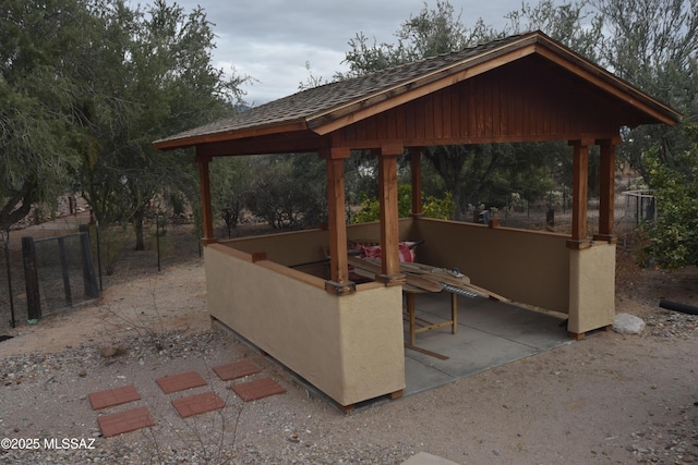 view of patio / terrace featuring a gazebo and a bar