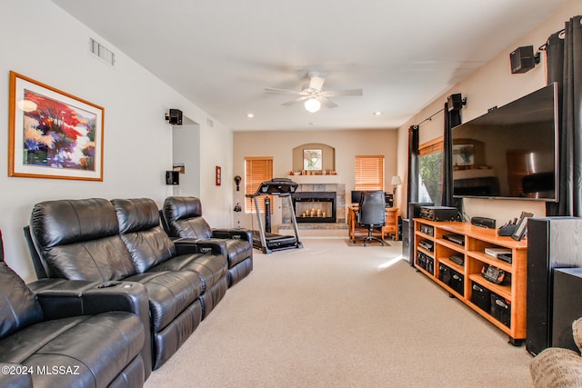 carpeted living room with ceiling fan