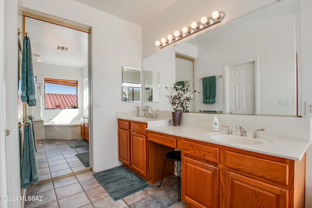 bathroom featuring vanity and a relaxing tiled tub