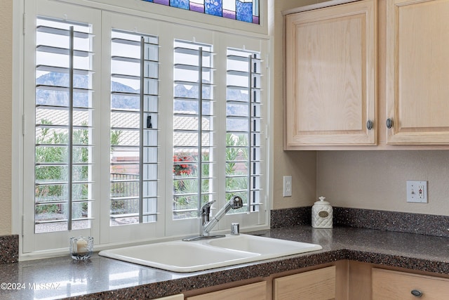 kitchen with plenty of natural light and light brown cabinets