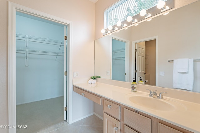 bathroom with tile patterned flooring and vanity