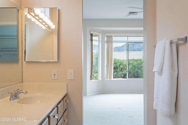 bathroom featuring a mountain view and vanity