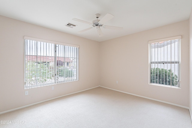 empty room with carpet and ceiling fan