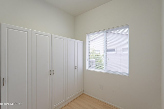 unfurnished bedroom with light wood-type flooring