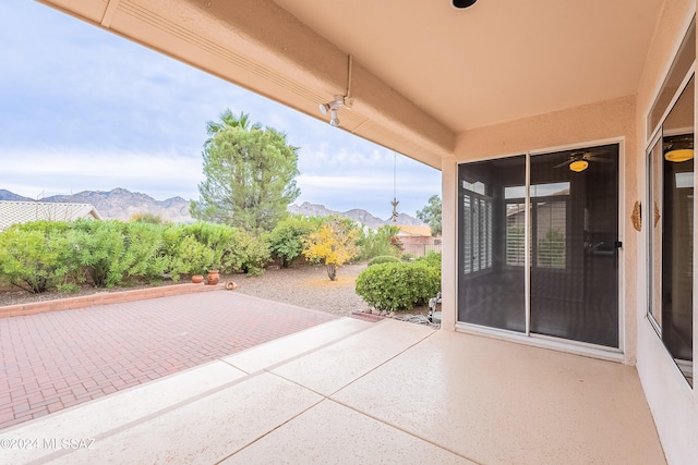 view of patio / terrace featuring a mountain view