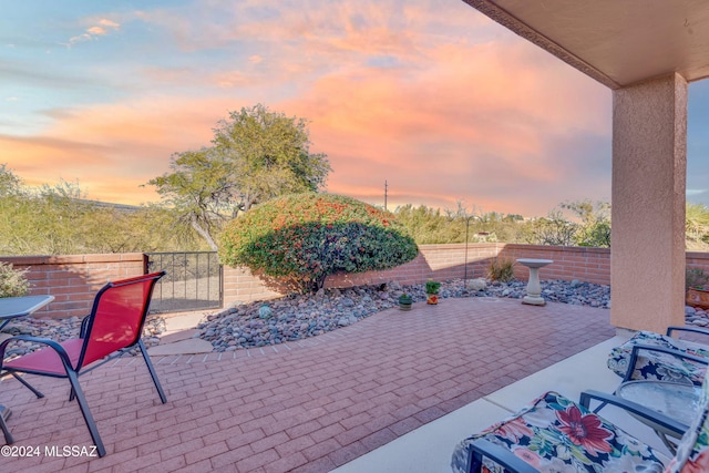 view of patio terrace at dusk