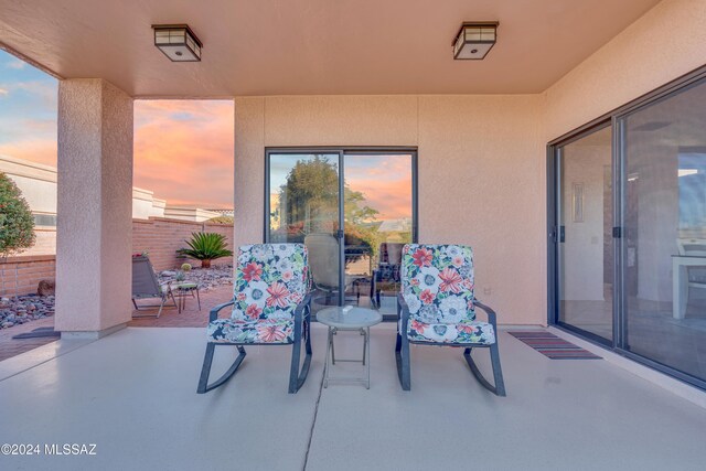 view of patio terrace at dusk