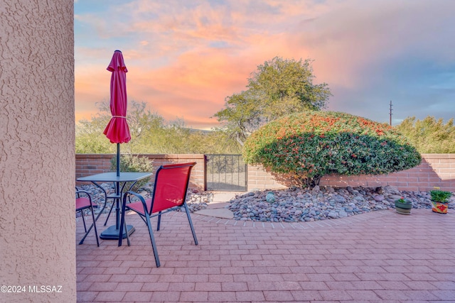 view of patio terrace at dusk